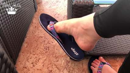 Goddess Misha Goldy: Flip flops dangling outdoor near lake with silver nails & toes...