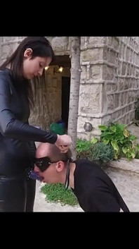 Blackhaired Domina in Latex Pissed Man in Mouth, Then He Licks Her After He Is Fucked Hard with a Strapon and Eats His Own Cum