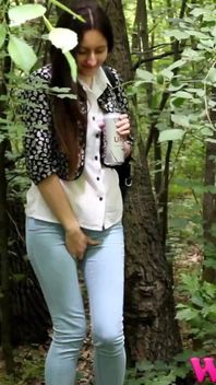 Skinny Brunette Desperate to Pee in the Woods Has to Find a Way to Empty Her Bladder