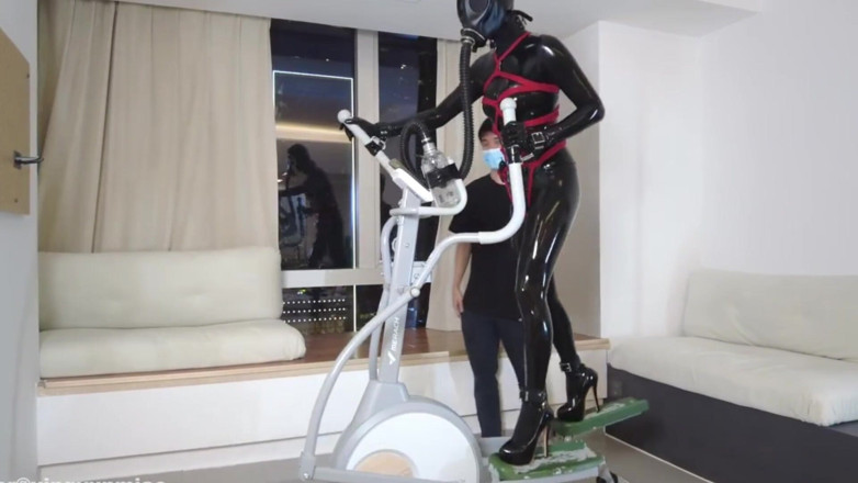 Aisan girl bondage: Mz27 - a Girl Bound in Latex Walks on a Treadmill