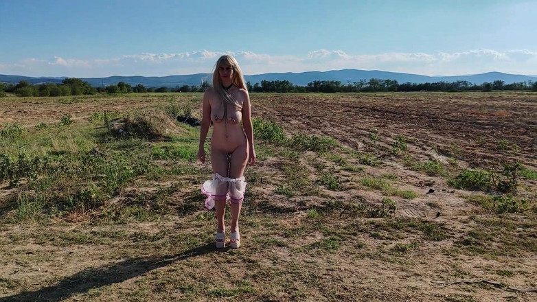 Za Za: Slave Tih Ie Walks in Skirt and Clitoral Chains