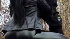 Ponytail Girl in a Leather Outfit Sucks Cock in the Forest and Takes Cum on Her Face - Vertical Vid