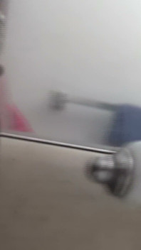 Busty Redhead in Glasses Films Herself Naked in the Bathroom Mirror
