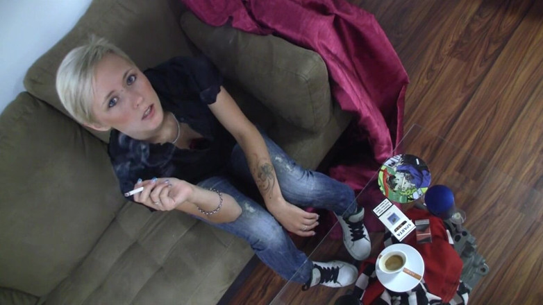 Smoke it bitch: Blonde young chick with piercing between her eyebrows smokes a...
