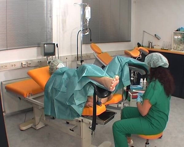 Rubber & Clinic Studio - 1ATOYS: Nurse in green surgery outfit