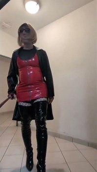 Public Walk in Parking House, Blonde in Overknee Boots, Red Pvc Dress and Long Leather Coat.