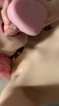 Sweet girl in fishnets using a dildo to fuck her pussy