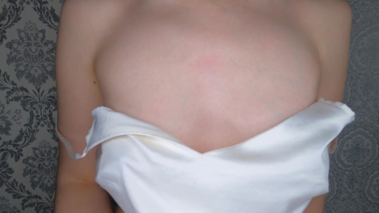 Kinodiva: Titted brunette rubs nipples with oil and plays with them
