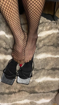 Fishnet in Open Toe Shoes with Red Nail Polish