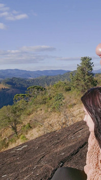 Tour Guide Shows Stick to Tourist on Mountain