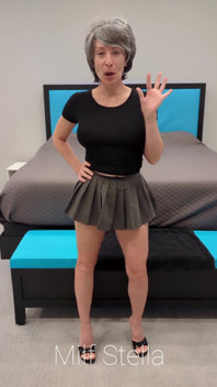 Sadie in a Grey Mini Skirt with a Black Top & Heels
