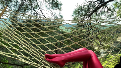 Shiny teens: Rose spandex pantyhose on a hammock in the mountains