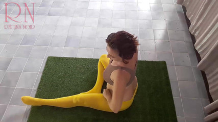 Regina Noir: Regina Noir. Yoga in yellow tights doing yoga in the...