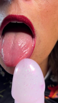 A Naughty Girl with Glasses Playing with Her Dildo