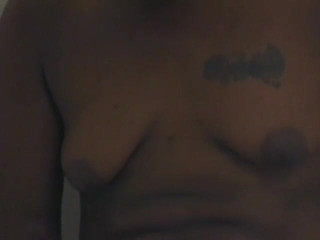 Hot and Wet: Short haired black chick shaves her pussy in the shower...