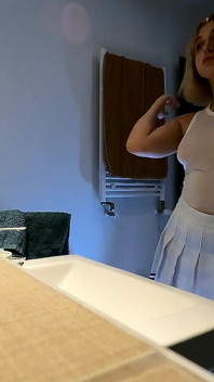 Cute and Hot Sexy Tight Pussy Cheerleader Shows Her Shaved and Wet Pussy Under Her Mini Skirt in the Bathroom
