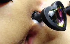 Rainbow heart butt plug exercising on the brink of my anus