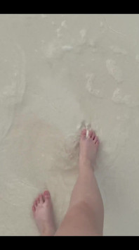 Running my bare feet on the white beach sand by the ocean.
