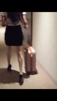 MILF in Stockings and Heels Walks Through the Corridors of a Hotel