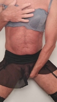 CD Trans Teases Strips Bra and Panties and Stockings Sheer Skirt