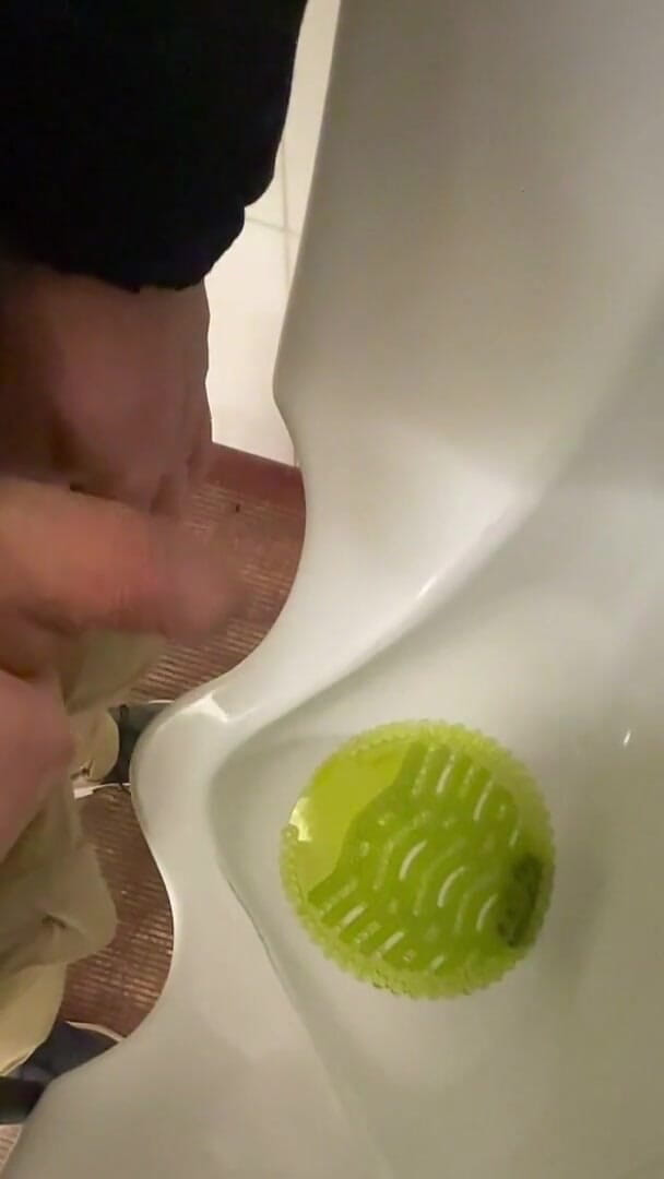 Amateur Redhead Guy Caught Pissing in a Public Toilet's Urinal - He Then Quickly Plays with His Cock Before Leaving (AmateurBoysPissing)