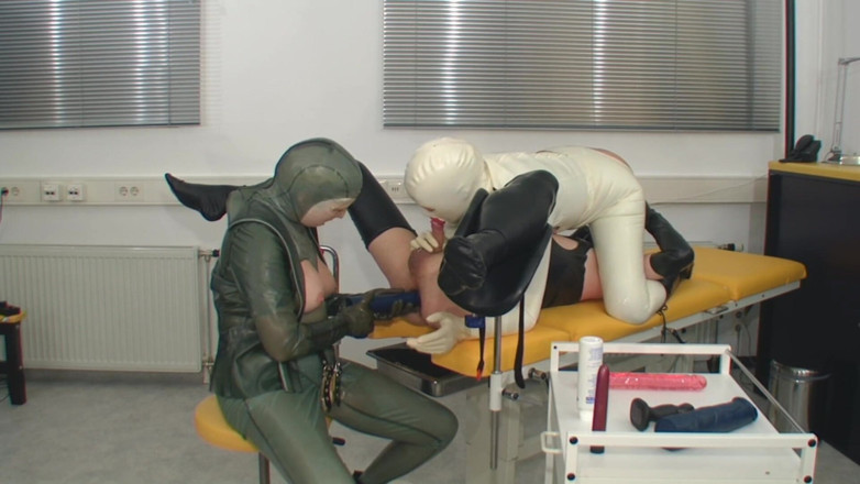 Rubber & Clinic Studio - 1ATOYS: Kinky rubber assfisting