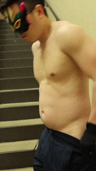 Flexing by the Stairs at the Gym