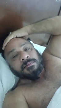 Indian Daddy Lying on the Bed Teasing and Posing for You