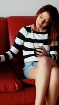 Skinny Redhead Smoking on a Couch