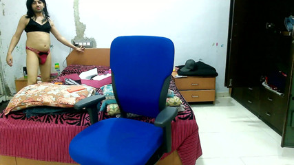 Cute & Nude Crossdresser: Crossdresser sitting on the chair with bra-panty in front of...