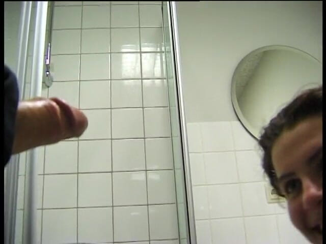 Lucky Cooch: Busty brunette is blowing hard dong in the bathroom