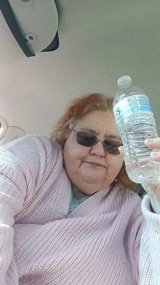 BBW nurse Vicki adventures with friends: BBW smoking in pink sweater in her car talking to...