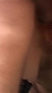 Redhead sucks two cocks in threesome and gets a warm load on her tits