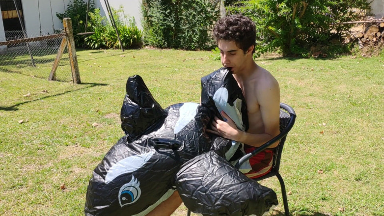 Floatie Boy: Beautiful Man Inflates His Inflatable Whale Near Pool Outside