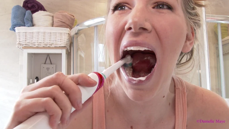 Danielle Maye: Pink Electric Toothbrush