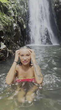 Monika Fox in Pink Top and Yellow Shorts Walks Through Jungle and Waterfalls!