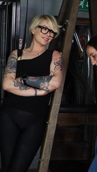Slave Mila's Feet Dangle and Quiver as Mistress Baton Breaks in Heavy Wooden Paddle Over Her Jeans and Bare