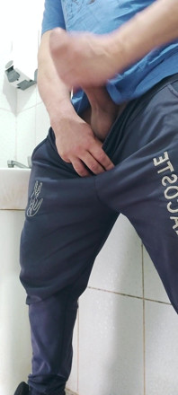 A Well-endowed Brazilian Man Urinating and Showing His Thick Penis to His Female Friends.