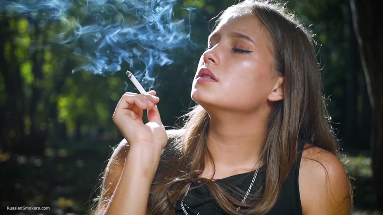 Russian Smokers: Seductive Russian Beauty Smoking Cigarette in Studio