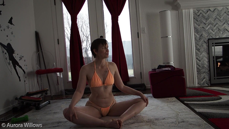 Aurora Willows: Stretching for your hamstrings in peach bikini