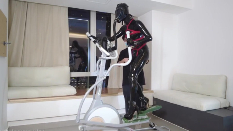 Aisan girl bondage: Mz27 - a Girl Bound in Latex Walks on a Treadmill