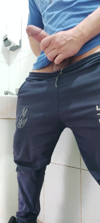 A Well-endowed Brazilian Man Urinating and Showing His Thick Penis to His Female Friends.