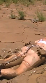 Julie Cunningham in Lingerie Wriggles Hard in Mud Hogtied with Chains. Sploshing Dirty Whore. Huge Tits Covered in Mud.