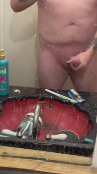 Masturbating