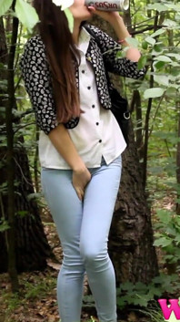 Desperate Brunette in a Forest Holding Her Crotch to Stop Herself From Pissing in Her Jeans