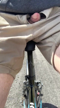 Young boy publicly flashing dick on the bike to strangers
