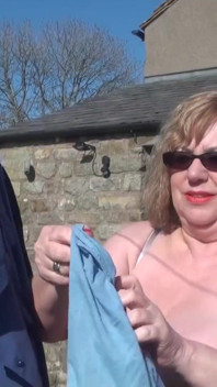 Trisha hanging out the washing