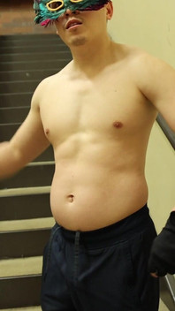 Flexing by the Stairs at the Gym