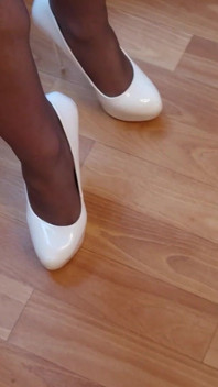 Walking in My High White Shiny Stilettos