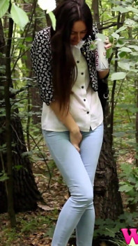 Desperate Brunette in a Forest Holding Her Crotch to Stop Herself From Pissing in Her Jeans